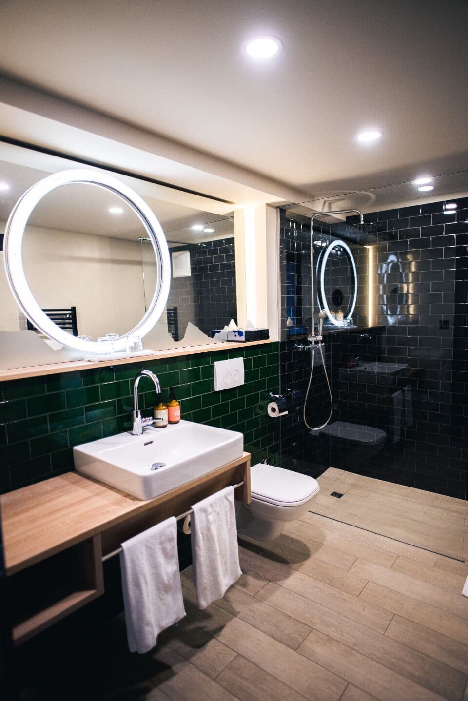 Tiled bathroom with a walk-in shower and basin