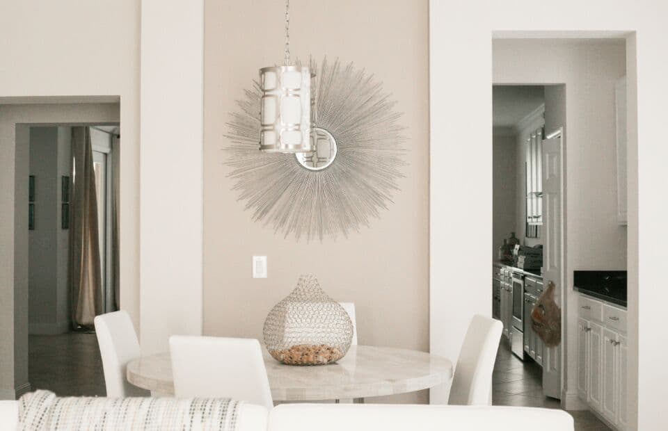 Shared dining table and chairs by a window