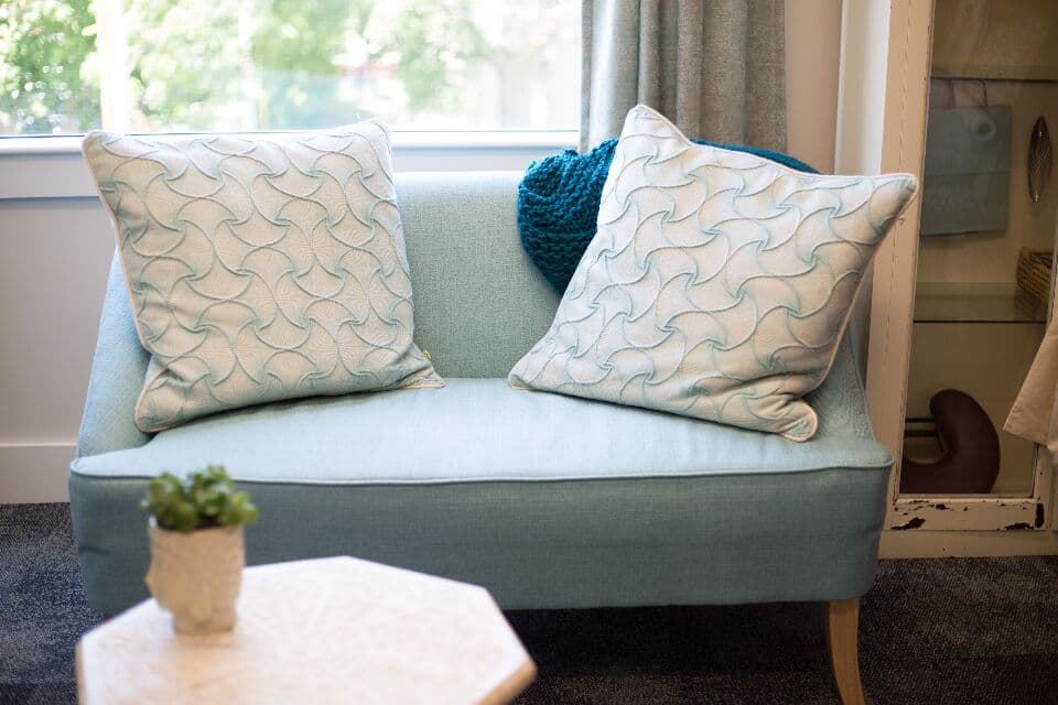 Sofa with cushions in a shared lounge