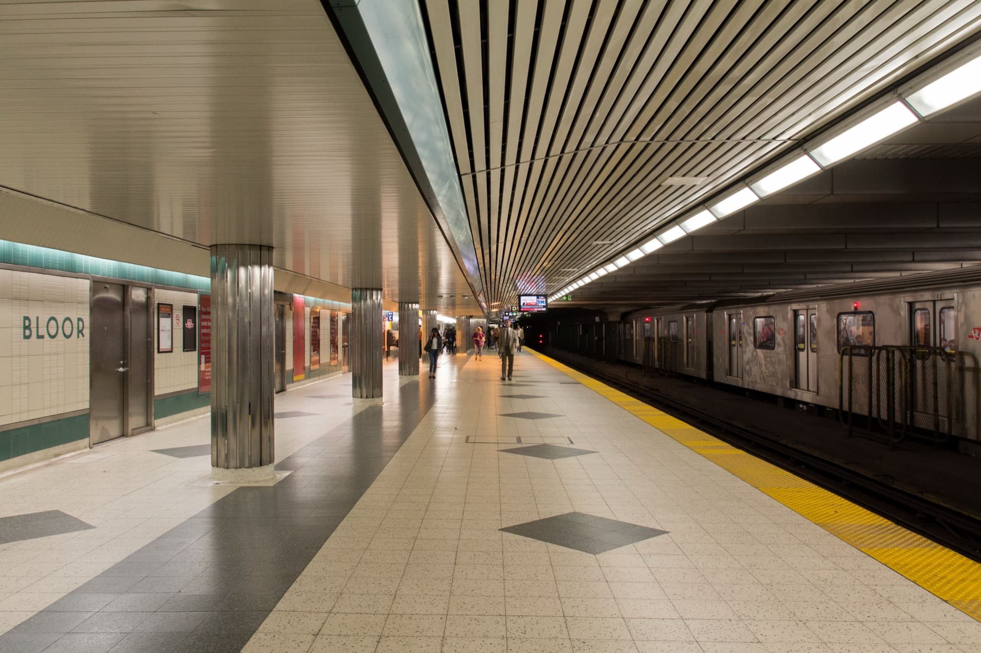 Platform at Bloor-Yonge subway station with a train at the far side